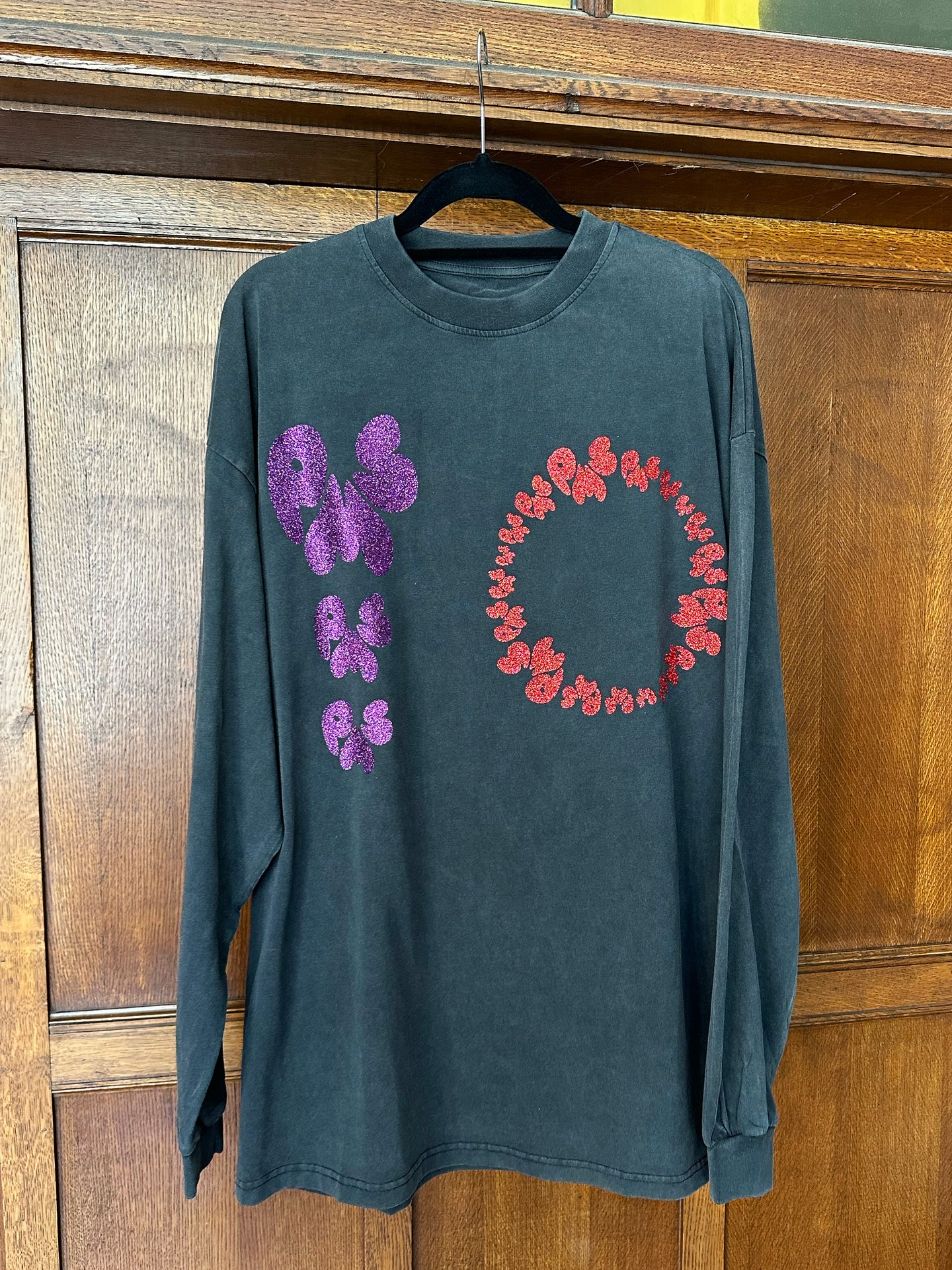 PURPLE AND RED GLITTER ON WASHED BLACK LONG SLEEVE T-SHIRT (SIZE S OVERSIZED FIT)