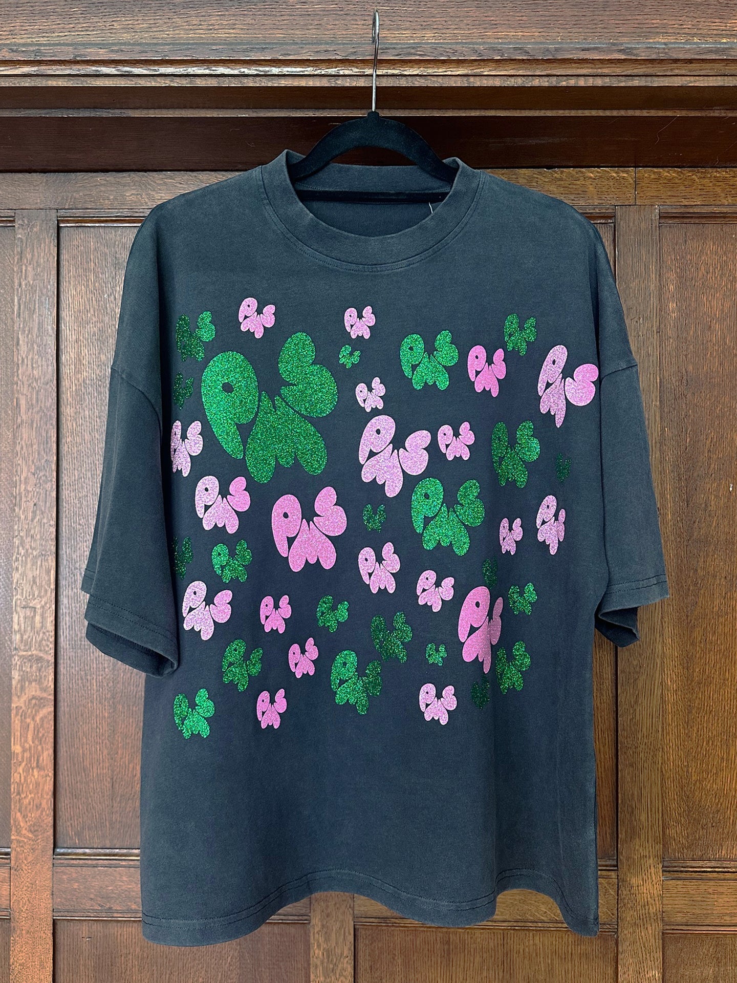 SOFT PINK AND DEEP GREEN ON WASHED BLACK T-SHIRT (SIZE S OVERSIZED BOXY FIT)